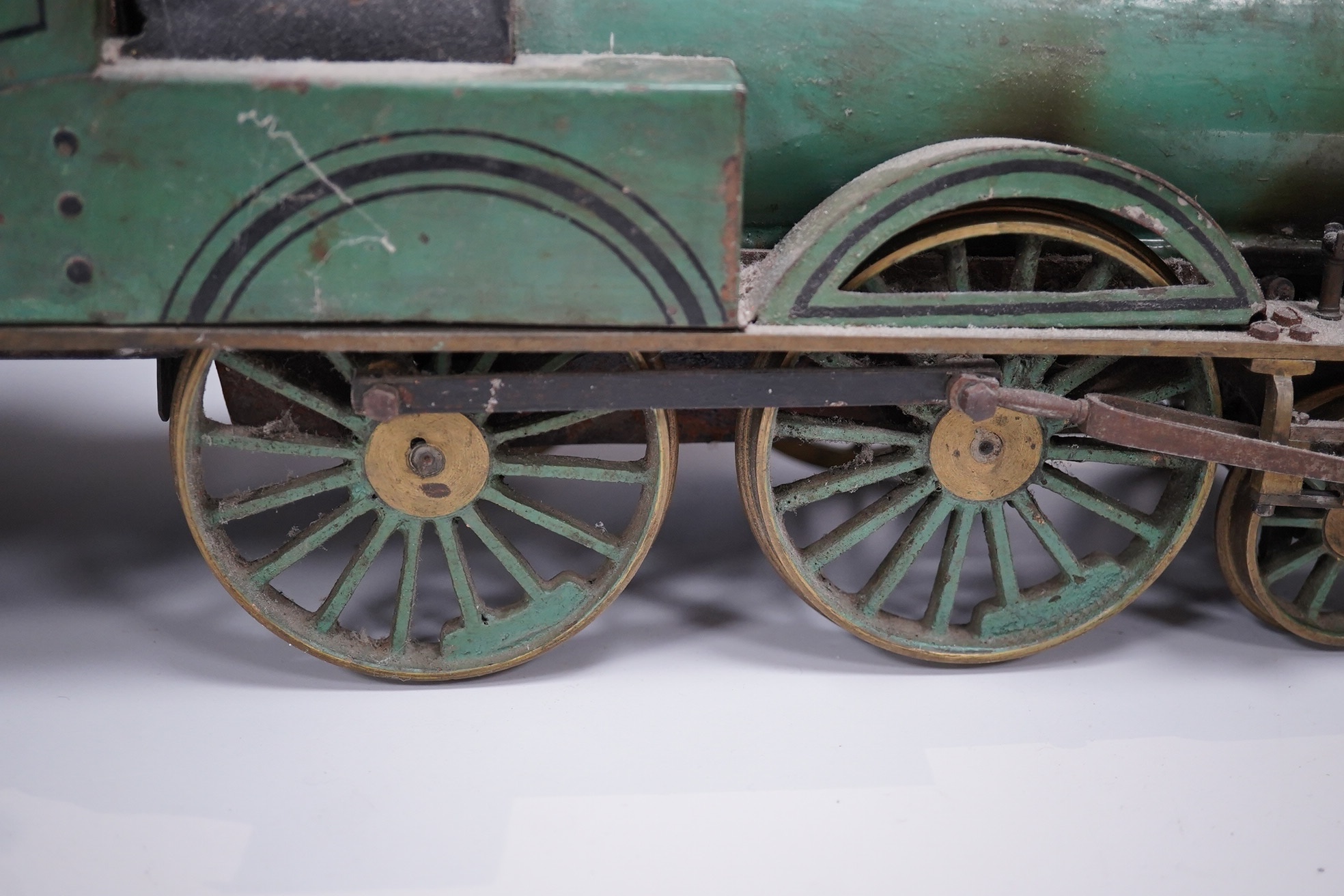 An early 20th century live steam four inch gauge 2-4-0 tender locomotive, possibly scratch built to a freelance design, spirit fired with two outside cylinders, Salter safety valve, reverser, whistle, etc. six wheel tend